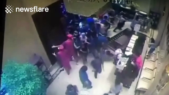 Crowd of house buyers rush into estate agents in China after prices plummet