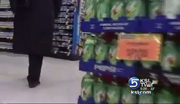 Furry thief , DOG shop lifting, grabs Christmas present out of grocery store aisle