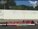 Hate graffiti spray-painted on wall and in yards