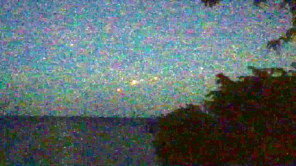 5 floating orbs over Lake Michigan