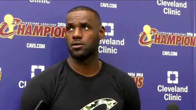 LeBron James stands behind his brother Chris Bosh