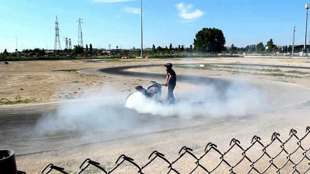 Stunt Bike Didi Burns a Wheel on Track - Supercar Motor Show