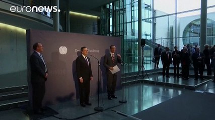 Draghi faces off against German critics