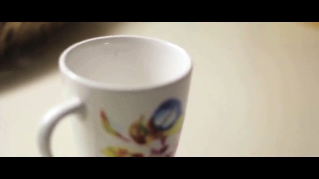 Filling a Cup With Water in Slow Motion