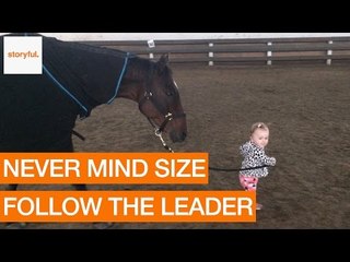 One-Year-Old Girl Leads Trusting Horse on Friendly Walk