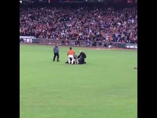 Giants Star Body Slams Field Invader to the Ground