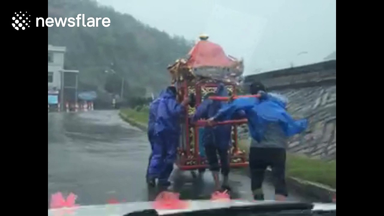 Couples in China press ahead with rainy weddings despite Typhoon Megi