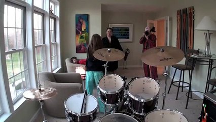 Very excited girl gets Drums for Christmas