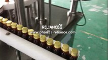 Designer Reliance Machinery - amber glass bottle 30ml beard oil filling and capping machine