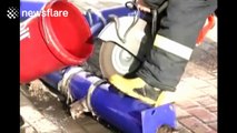 Firefighters rescue cat, stuck in pipe