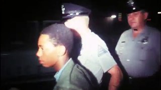 09-06-68 Police walk a young man in handcuffs to the Roanoke, Va., city jail; another handcuffe...