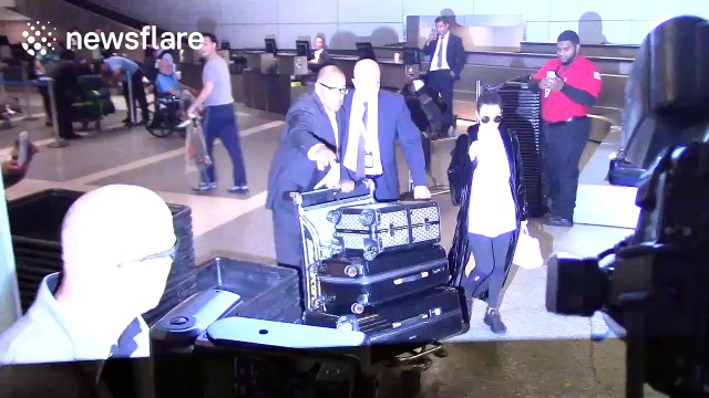 Kourtney Kardashian gets mobbed by paparazzi after sister Kim was attacked in Paris