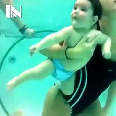 swimming mum and baby