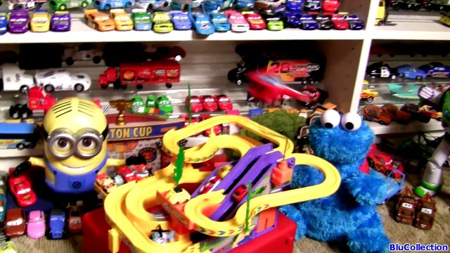 Cookie Monster at the Race Track Watching Mini Micro Cars Racing Up the Escalator by Blutoys
