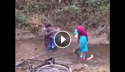 Man and woman fall in water mud