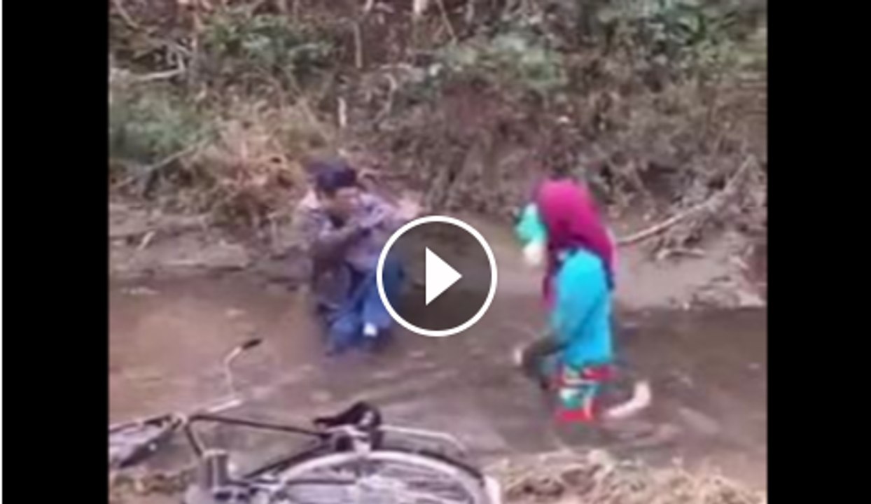 Man and woman fall in water mud