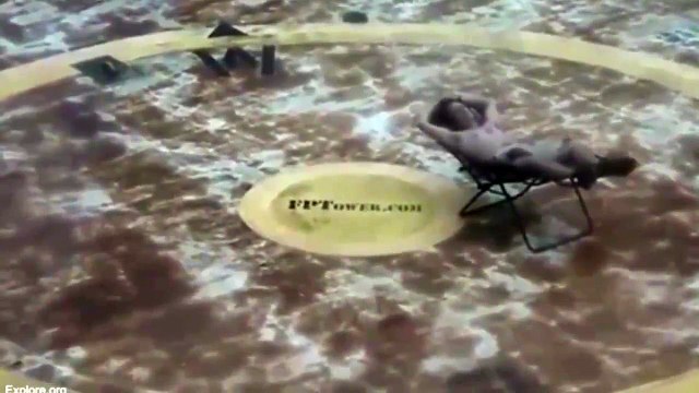 Incredible footage captures man SUNBATHING during Hurricane Matthew on roof of Coast Guard station