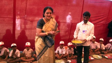 Nandai and Suchitdada serving food to students during Kolhapur Medical & Healthcare camp - 3