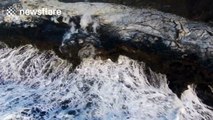 Incredible drone footage of lava flows entering the ocean in Hawaii
