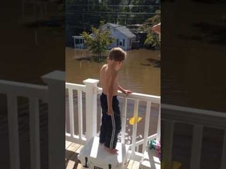 Family in Windsor Catches Fish in Floodwaters