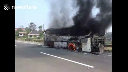 Coach catches fire on motorway in China
