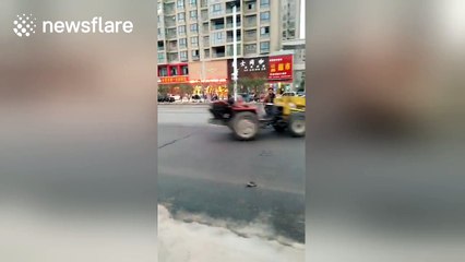 Out-of-control, driverless forklift truck does big doughnuts on road