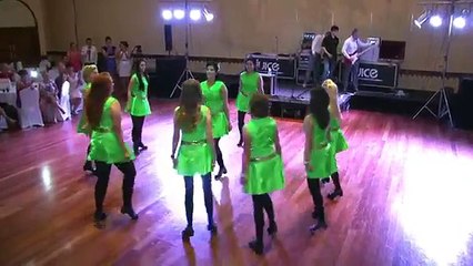 Participating in a wedding reception and begin to dance