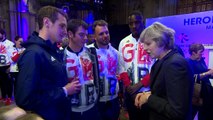 Theresa May mingles with Olympic and Paralympic stars