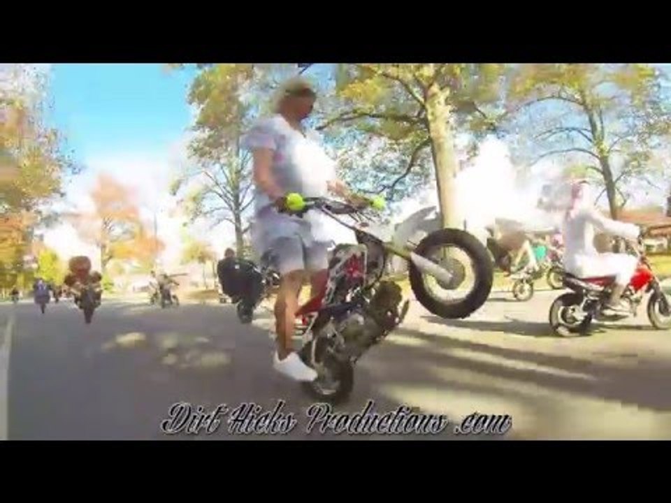 Motorcyclist Performs Wheelies on a 50CC Pit Bike in Grandma Outfit