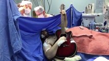 Watch this guy get brain surgery while playing The Beatles’ “Yesterday” on guitar