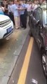 Driver Smashes a Car Blocking his driveway in the parking lot