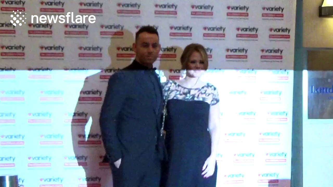 Kimberley Walsh clutches her bump at Variety Showbiz Awards