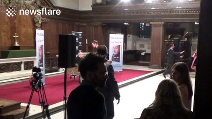 Phil Collins appears to struggle to get out of chair at Q&A in London