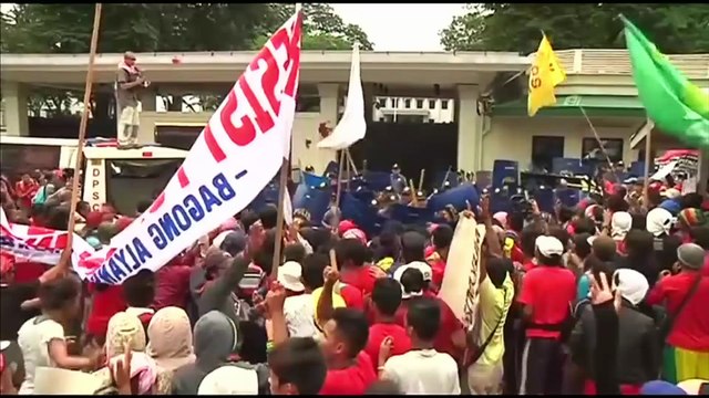 Philippine police van rams activists protesting outside the U.S. embassy