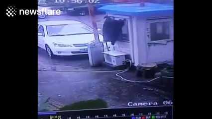 Typhoon Haima blows over security checkpoint in China