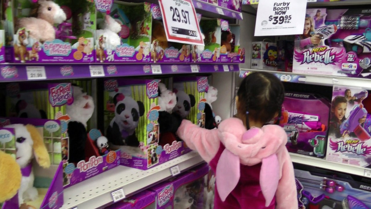 Girl Looking At The Dolls