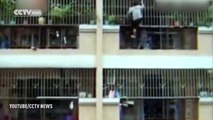 Child kidnapper jumps off balcony onto car roof and right into the clutches of angry crowd armed wit