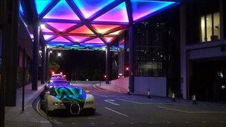 Purple and cream Bugatti Veyron driving fast in London
