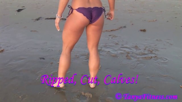 female bodybuilder flexing muscular legs