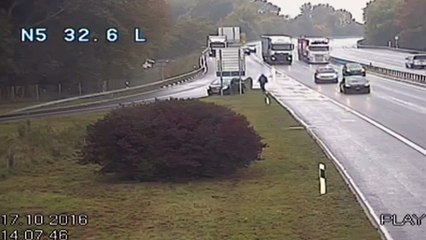 Man chases runaway car across busy motorway