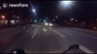 Biker crashes into car doing a U-turn