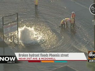 Large water main break floods road in Phoenix