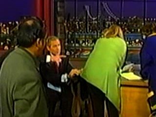 George w bush - cleans glasses on womans shirt