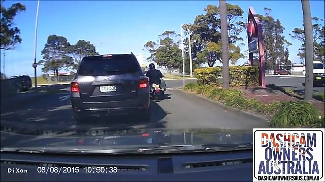 Man punches motorcyclist in HELMET during road rage incident