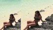 TOWIE's Courtney Green flaunts her tanned stomach in tiny bikini