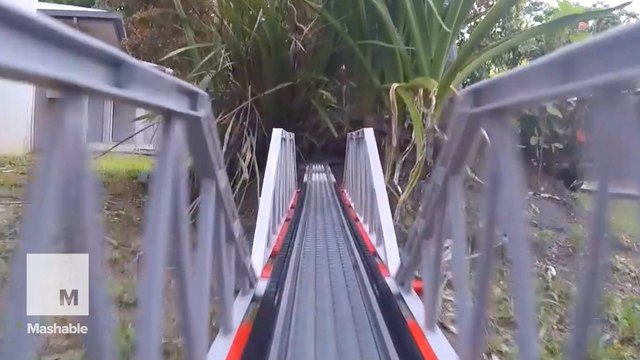 Ride this tiny train through the gigantic Lego railroad of your dreams