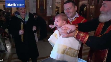 Epiphany marked with head spinning baptisms in Georgia