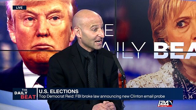 Amid firestorm, FBI obtains warrant to examine Clinton emails