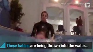 Babies thrown into water to teach them survival skills
