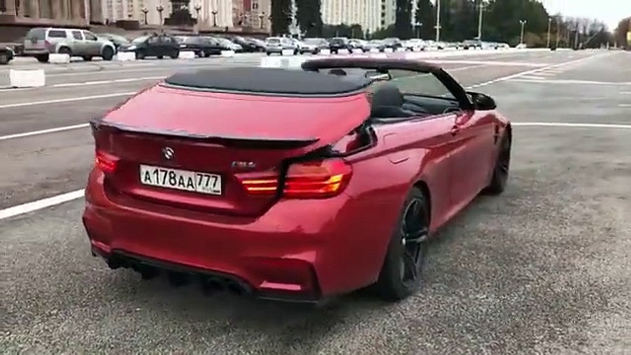 BMW M4 dropping its top in style.